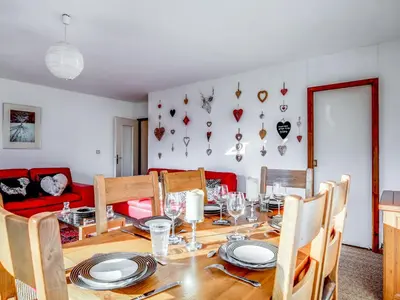 a living room with a couch and a table at Apartment Fleurs des Alpes-1 by Interhome in Saint-Gervais-les-Bains