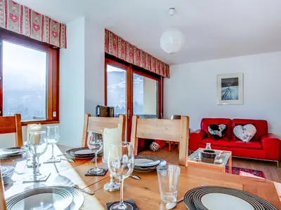 a dining room with a wooden table and chairs at Apartment Fleurs des Alpes-1 by Interhome in Saint-Gervais-les-Bains