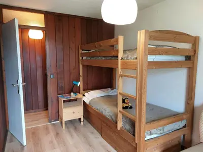 a bathroom with a sink and a toilet and a shelf with towels at Apartment Le Sporting-1 by Interhome in Saint-Gervais-les-Bains