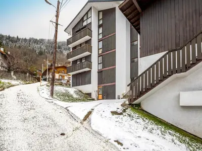 a building with a fence on the side of it at Apartment Le Sporting-1 by Interhome in Saint-Gervais-les-Bains
