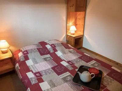 a kitchen with a stove and a white refrigerator at Apartment Clos du Savoy-23 by Interhome in Chamonix-Mont-Blanc