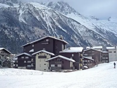 a view of a park from a balcony with a bench at Apartment Clos du Savoy-23 by Interhome in Chamonix-Mont-Blanc