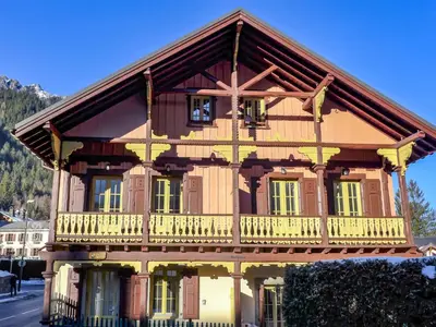 a large wooden house with a balcony at Apartment Le Chalet Suisse-3 by Interhome in Chamonix-Mont-Blanc