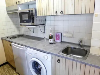 a kitchen with a washing machine and a sink at Studio L'Aiguille du Midi-7 by Interhome in Chamonix-Mont-Blanc