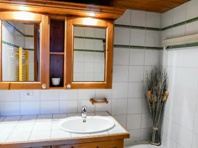 a bathroom with a sink and a window at Apartment Ginabelle 1-1 by Interhome in Chamonix-Mont-Blanc