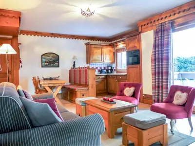 a living room with a couch and a table at Apartment Ginabelle 1-1 by Interhome in Chamonix-Mont-Blanc