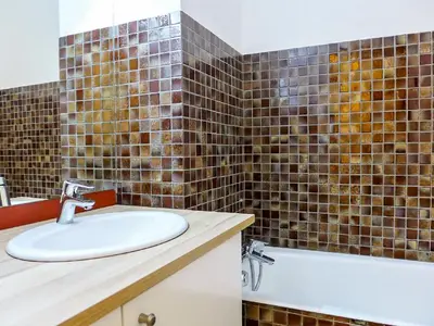 a bathroom with a sink and a bath tub at Studio Le Pramouny-2 by Interhome in Chamonix-Mont-Blanc
