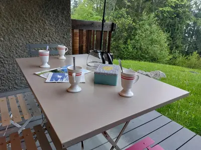 a table with two cups and a tea kettle on it at Studio Le Taguy by Interhome in Mémontel