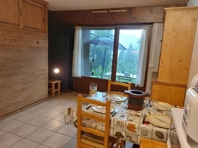 a kitchen with a table and chairs in a room at Studio Le Taguy by Interhome in Mémontel