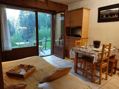 a bedroom with a large yellow bed with two boxes on it at Studio Le Taguy by Interhome in Mémontel