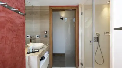 a bathroom with a sink and a shower at MGM Hôtels & Résidences - Résidence Alexane in Samoëns