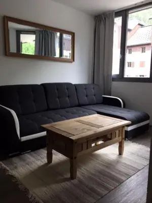 a living room with a couch and a coffee table at Chamois Blanc in Chamonix-Mont-Blanc