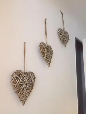 a group of hearts hanging on a wall at Chamois Blanc in Chamonix-Mont-Blanc