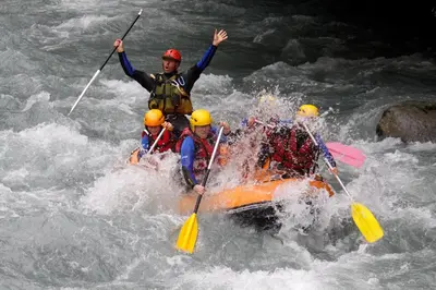 a group of people in a raft in the water at Giffre in Samoëns