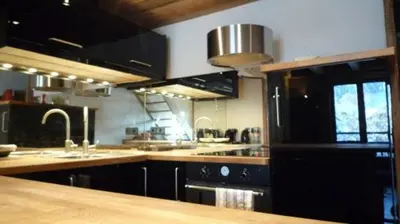 a kitchen with a sink and a counter top at Appartement du Petit Bois in Megève
