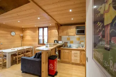 a kitchen and dining area of a log cabin at Résidence Mont Joly2 in Saint-Gervais-les-Bains
