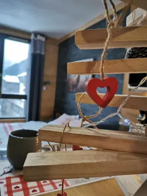 a wooden sign with a red heart on it at La Cabane in Chamonix-Mont-Blanc