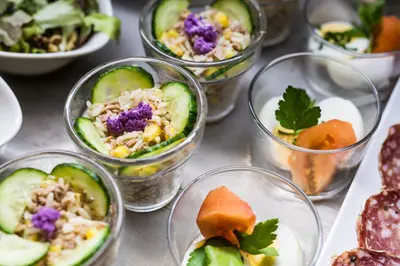 a group of glass bowls filled with different types of food at Village Vacances le Bérouze in Samoëns