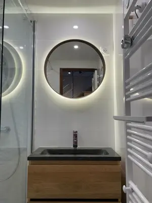 a bathroom with a sink and a mirror at Residence La Verte 24- Aux Pieds des pistes! in Chamonix-Mont-Blanc