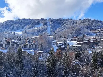 a village in the snow with a mountain at Holiday Home Les Farfadets by Interhome in Saint-Gervais-les-Bains