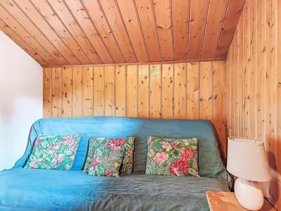 a white table with a bottle of wine on it at Holiday Home Les Farfadets by Interhome in Saint-Gervais-les-Bains