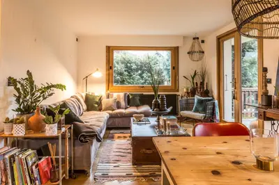 a living room with a couch and a table at Appartement Native in Chamonix-Mont-Blanc