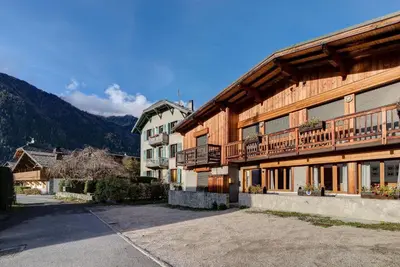 a large wooden building with a balcony on it at BIOLAY 2 - Alpes Travel - Central Chamonix - Sleeps 4-6 in Chamonix-Mont-Blanc
