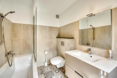 a bathroom with a sink and a toilet and a shower at Aran Apartment - Chamonix in Chamonix-Mont-Blanc