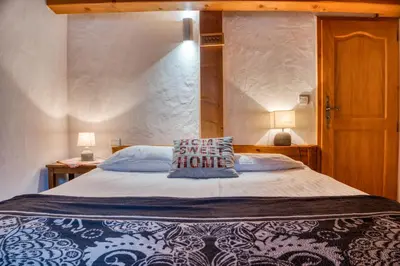 a bedroom with a large bed with a pillow on it at Clos 3 - Chamonix in Chamonix-Mont-Blanc