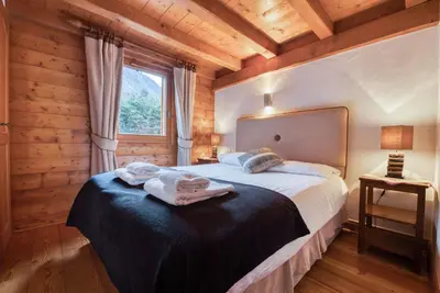 a bedroom with a bed with towels on it at Clos 3 - Chamonix in Chamonix-Mont-Blanc