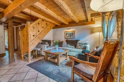 a living room with a couch and a table at Clos 3 - Chamonix in Chamonix-Mont-Blanc