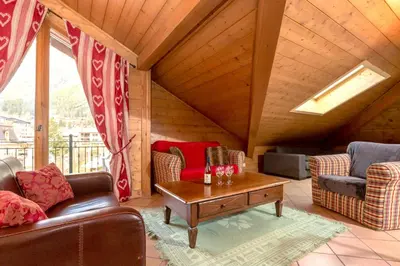 a living room with couches and a coffee table at Polaris - Chamonix in Chamonix-Mont-Blanc