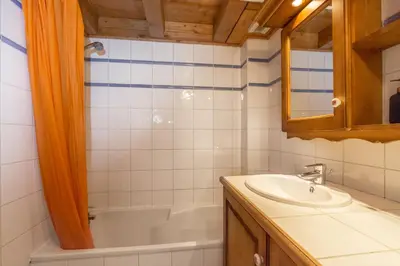 a bathroom with a sink and a bath tub at Polaris - Chamonix in Chamonix-Mont-Blanc