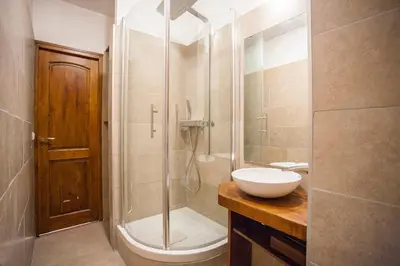 a bathroom with a shower and a sink at Vieux Palais - Chamonix in Chamonix-Mont-Blanc