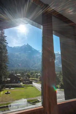 a window with a view of a mountain at Chalet des Lacs - Chamonix in Chamonix-Mont-Blanc