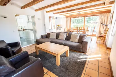 a living room with two couches and a coffee table at Chalet des Lacs - Chamonix in Chamonix-Mont-Blanc