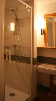 a bathroom with a shower and a sink at Village De Vacances Les Flocons Verts in Les Carroz d'Araches