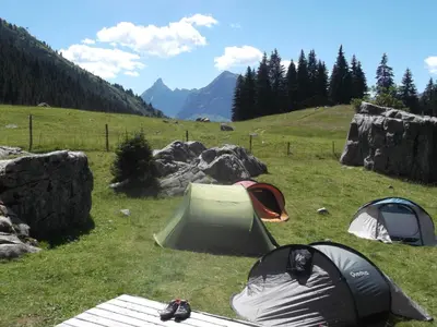 a group of tents sitting on a grass field at Village De Vacances Les Flocons Verts in Les Carroz d'Araches