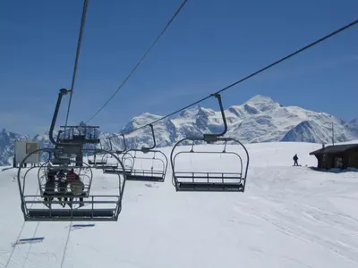 a ski lift with people on it in the snow at Samoëns Apartment 2 bedroom 50m2 modern and well equipt in Samoëns