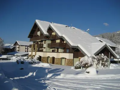 a snow covered house with a roof with snow at Samoëns Apartment 2 bedroom 50m2 modern and well equipt in Samoëns