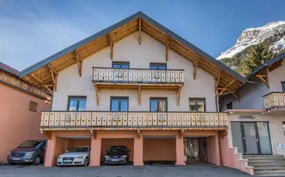 a room with skis and ski equipment on a wall at Les Edelweiss Mont-Blanc - Gîte Classé 3 Etoiles in Passy