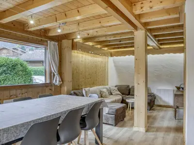 a living room with a table and a couch at Chalet 4 Chambres à Megève, 10 Pers, Calme, Wifi, Proche Centre - FR-1-453-1 in Megève