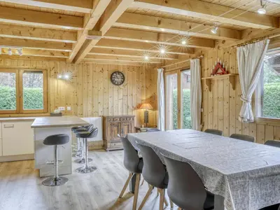 a kitchen and dining room with a table and chairs at Chalet 4 Chambres à Megève, 10 Pers, Calme, Wifi, Proche Centre - FR-1-453-1 in Megève