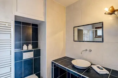 a bathroom with a sink and a toilet at APARTMENT PRESIDENT - Alpes Travel - Central Chamonix - Sleeps 12 in Chamonix-Mont-Blanc
