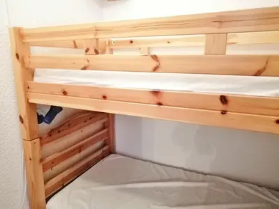 a wooden shelf in a room with a bed at Appartement 2 pièces + cabine, 6 personnes, Morillon 1100, au pied des pistes - FR-1-815-63 in Morillon