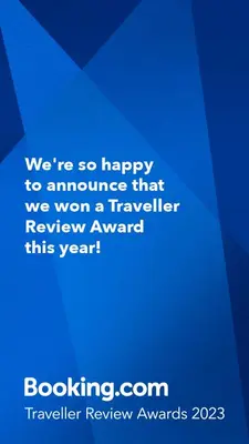 a blue sign that says were so happy to announce that we won a traveler at Appartement Hameau des Pistes - Ski-in and Ski-out in Megève