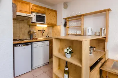 a bedroom with a large bed with towels on it at Appartement Le Chamois in Megève