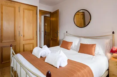 a living room with a couch and a table at Appartement Le Chamois in Megève