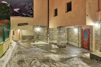 a room with a pool of water in a building at Carabiner: Residence Espace Montagne in Chamonix-Mont-Blanc