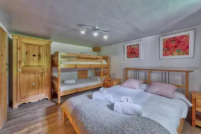 a bedroom with two beds and a bunk bed at Chalet Heidi in Chamonix-Mont-Blanc